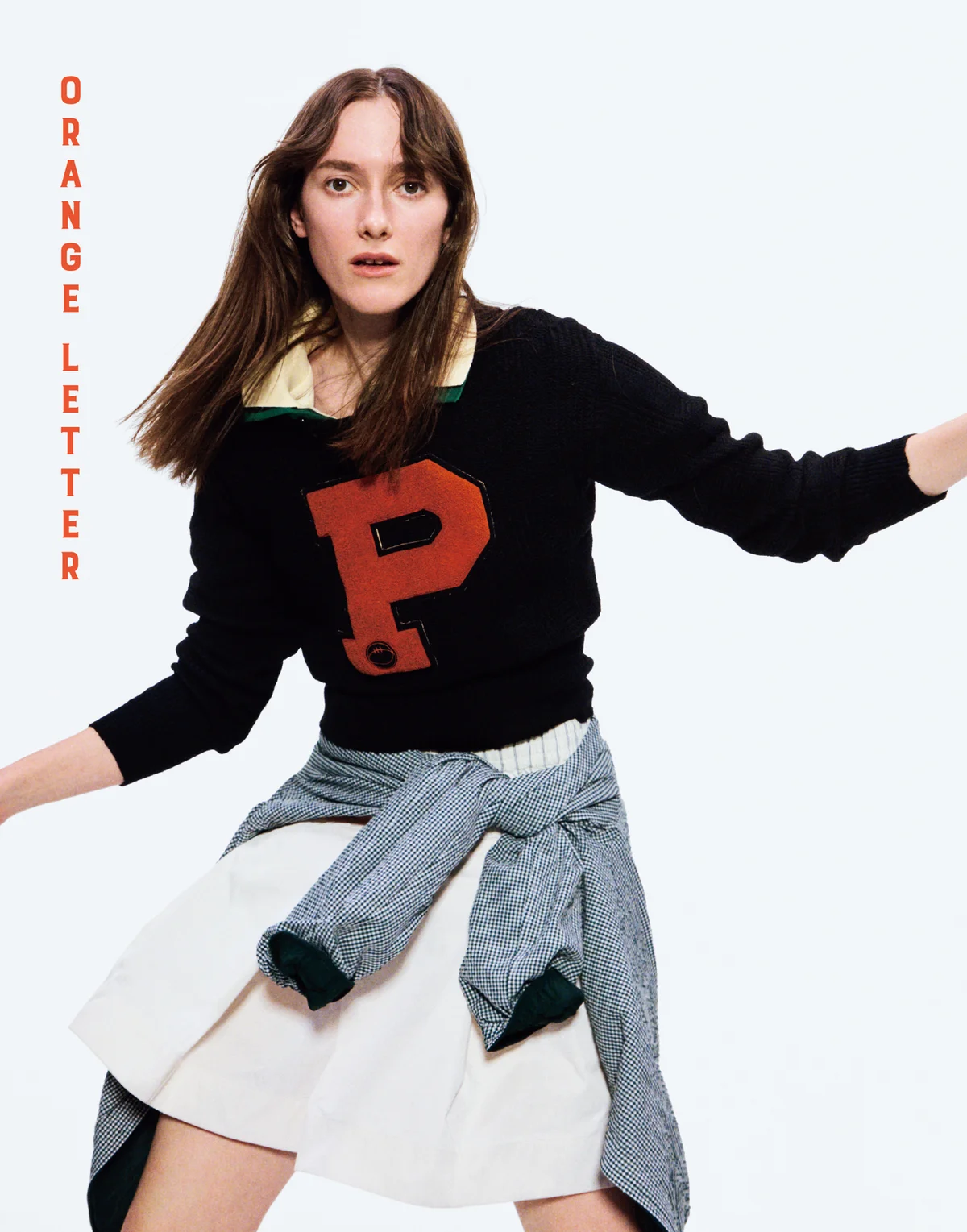 ラコステのニットを着用した着こなし