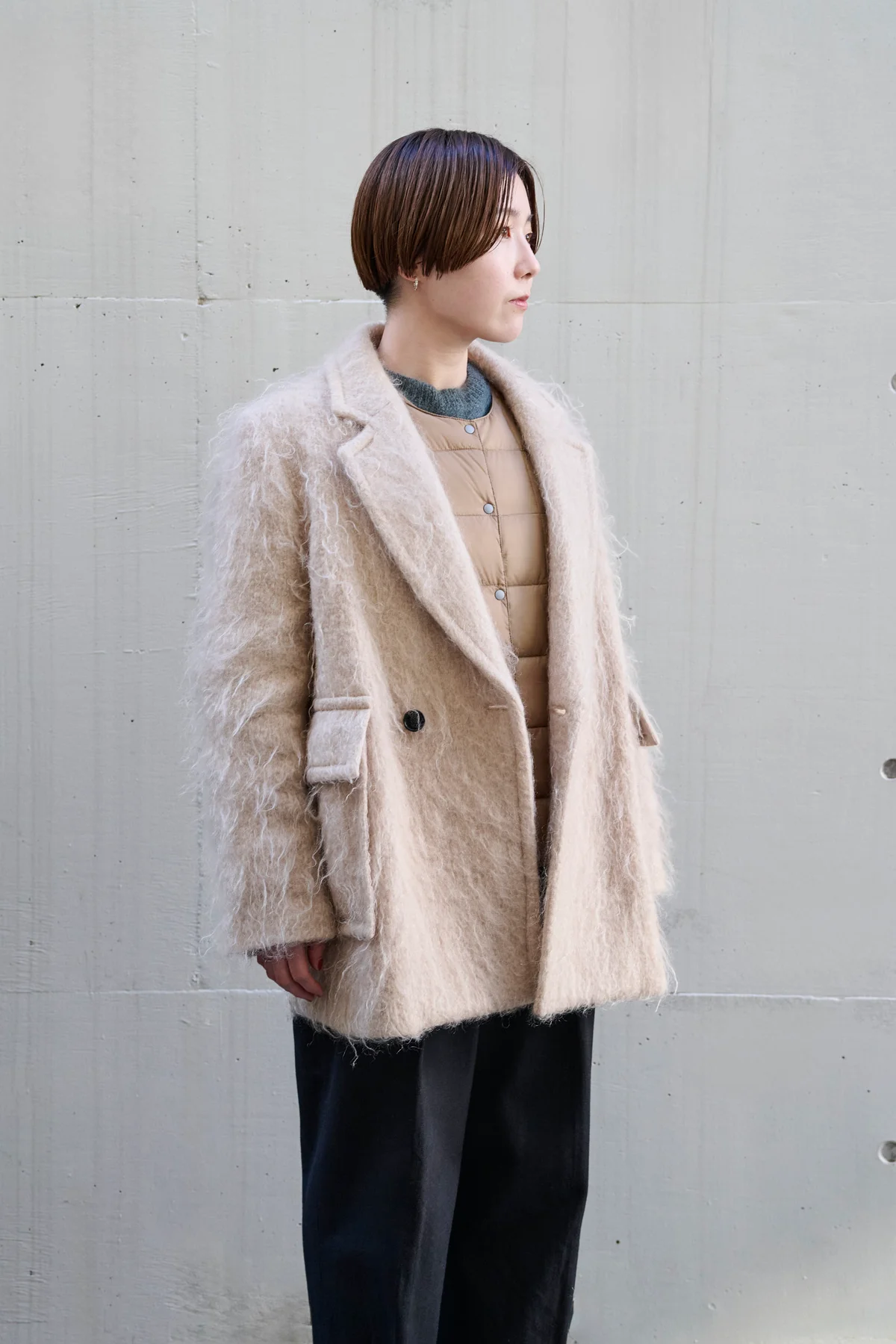 タイオンのクルーネックボタン インナーダウンジャケット