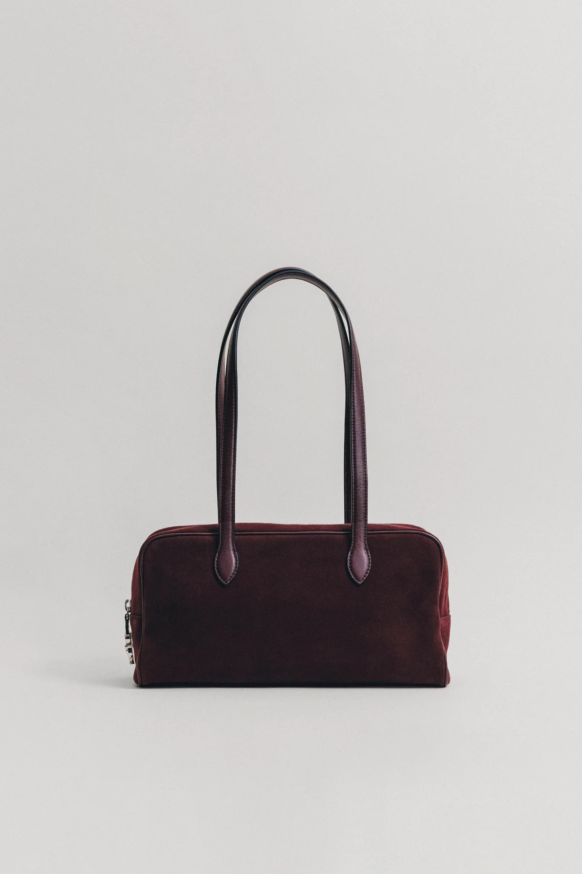 トゥティエ バーガンディ色のスエードバッグ