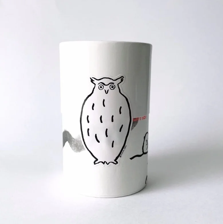 The owl is firmly enshrined in the cylindrical box and is cute.